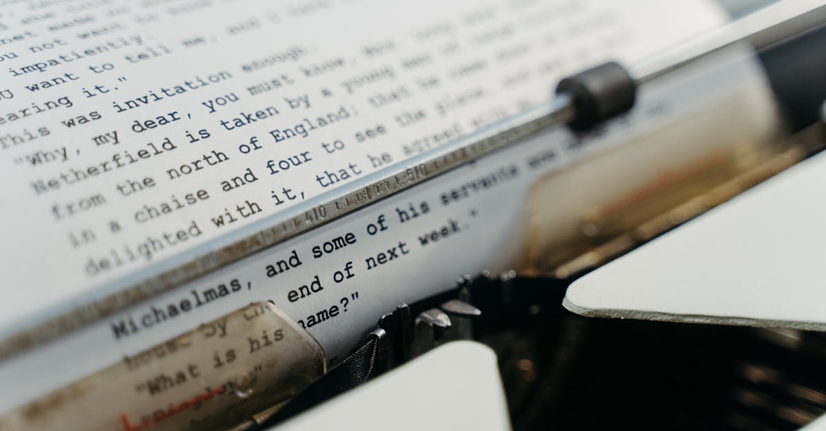 Close-up of a vintage typewriter typing manuscript pages in a classic style.