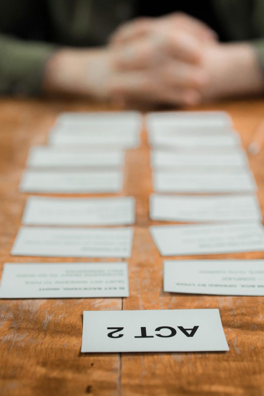 Close-up of storyboard cards arranged on a table for scriptwriting planning.